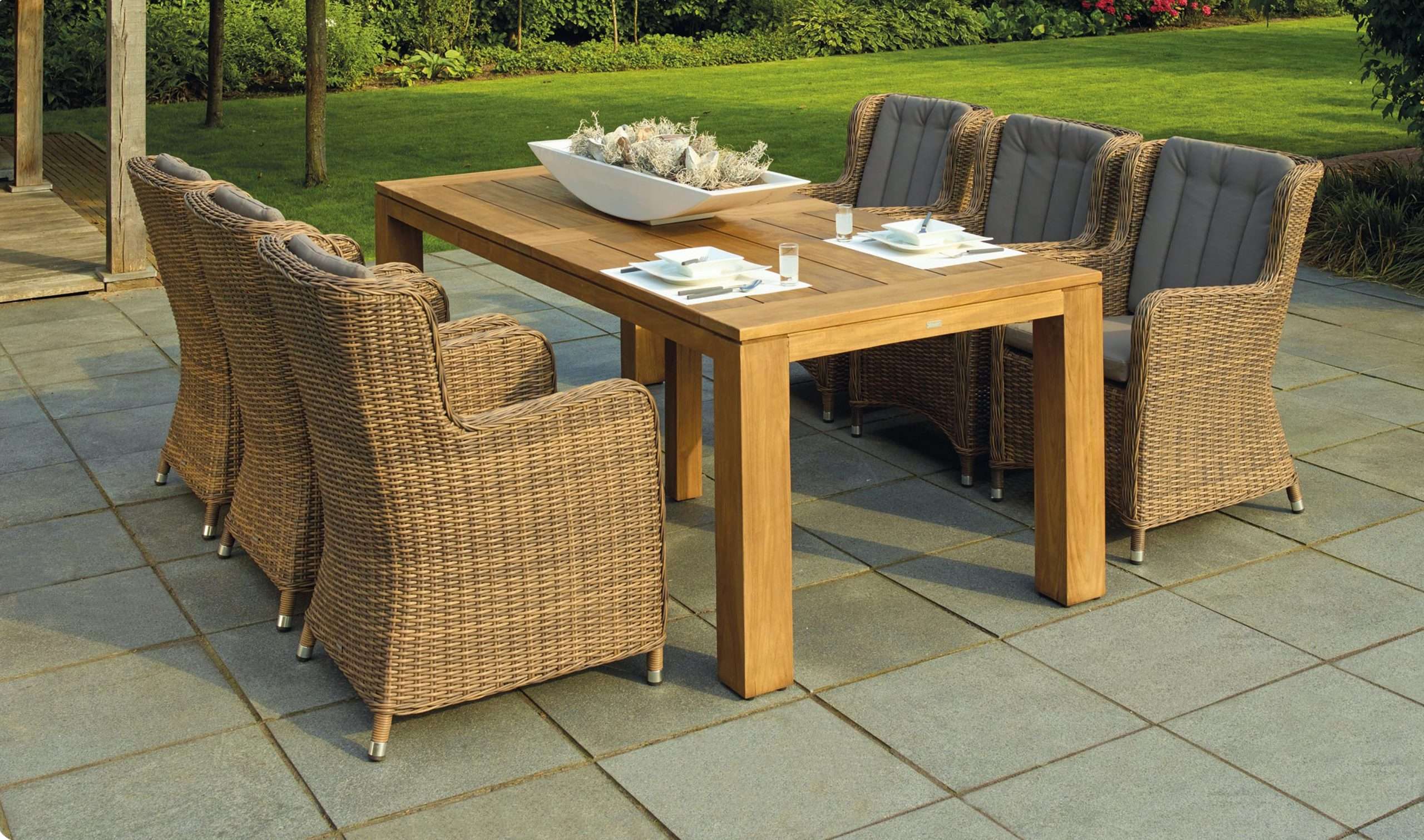 Outdoor table and chairs look great with a well manicured lawn